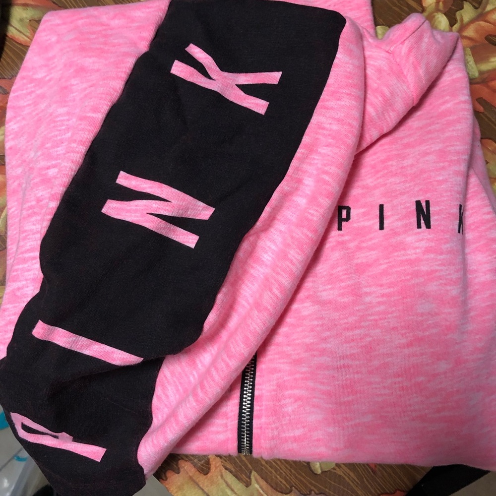Small pink sweatshirt.